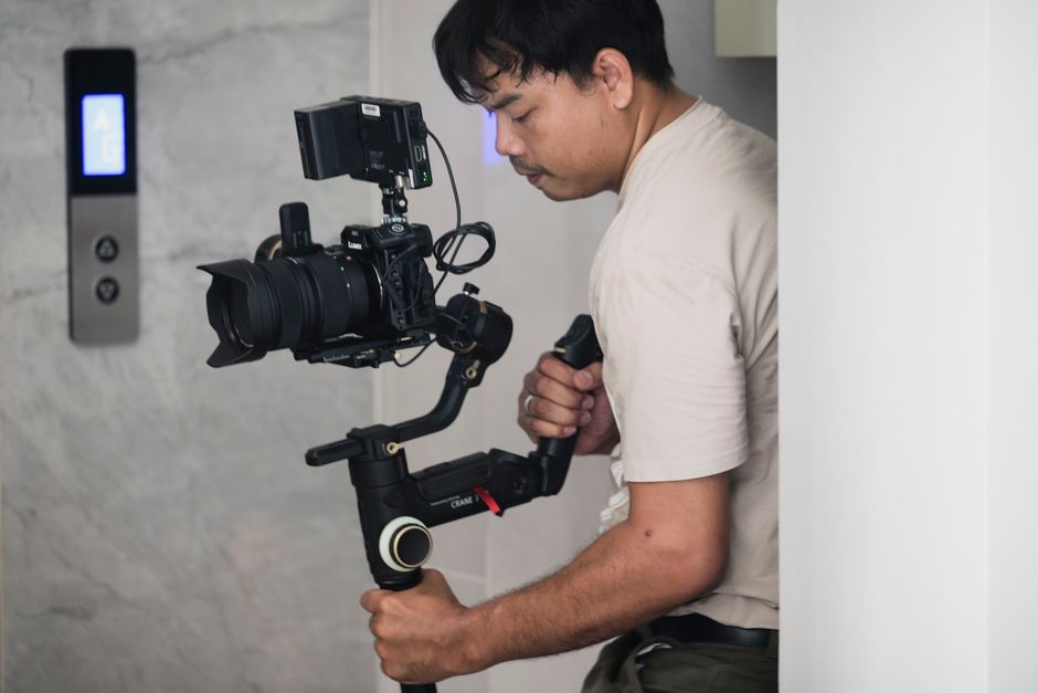 Wedding videographer holding a camera on location